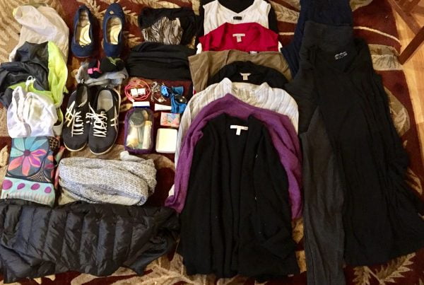 doing laundry when traveling clothes and shoes laid out on the floor