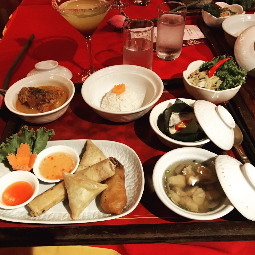 tray with multiple plates and dishes of all sorts of food