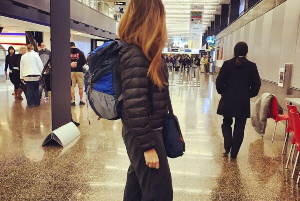 stuck at the airport sarah with backpack