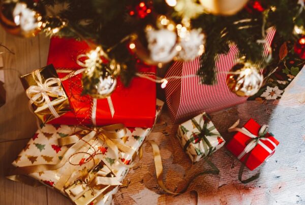 Day 4: 12 Days of Christmas wrapped presents under a tree