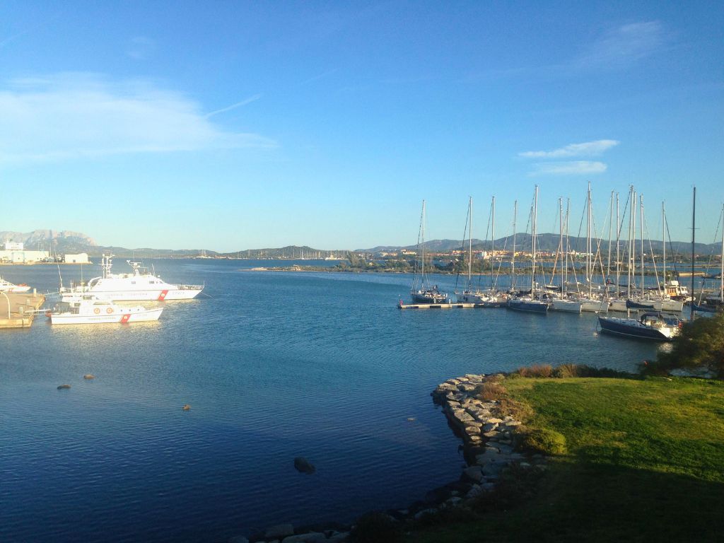 olbia port with ferries and sailboats