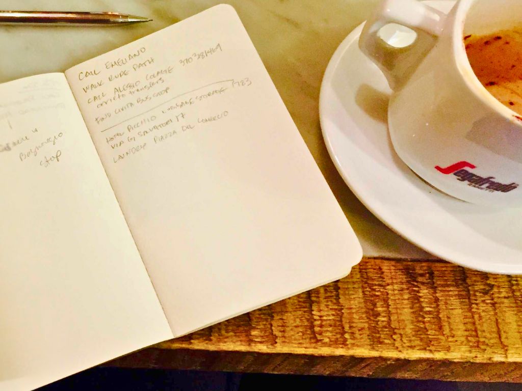 travel notebook and coffee cup