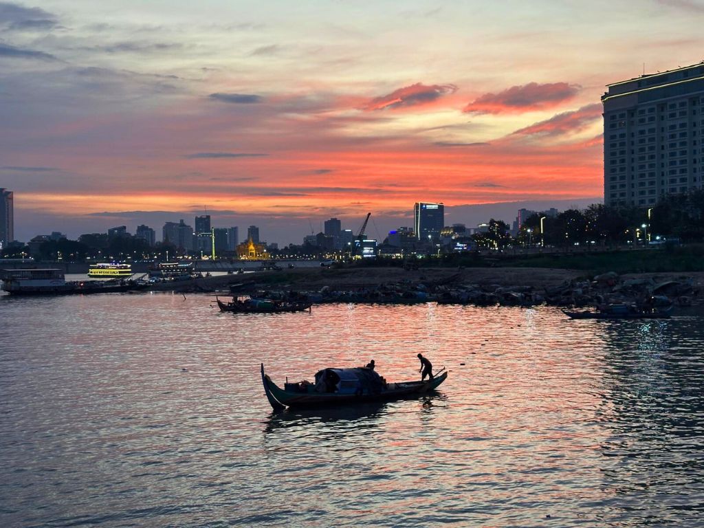 view of phnom penh at sunset from river