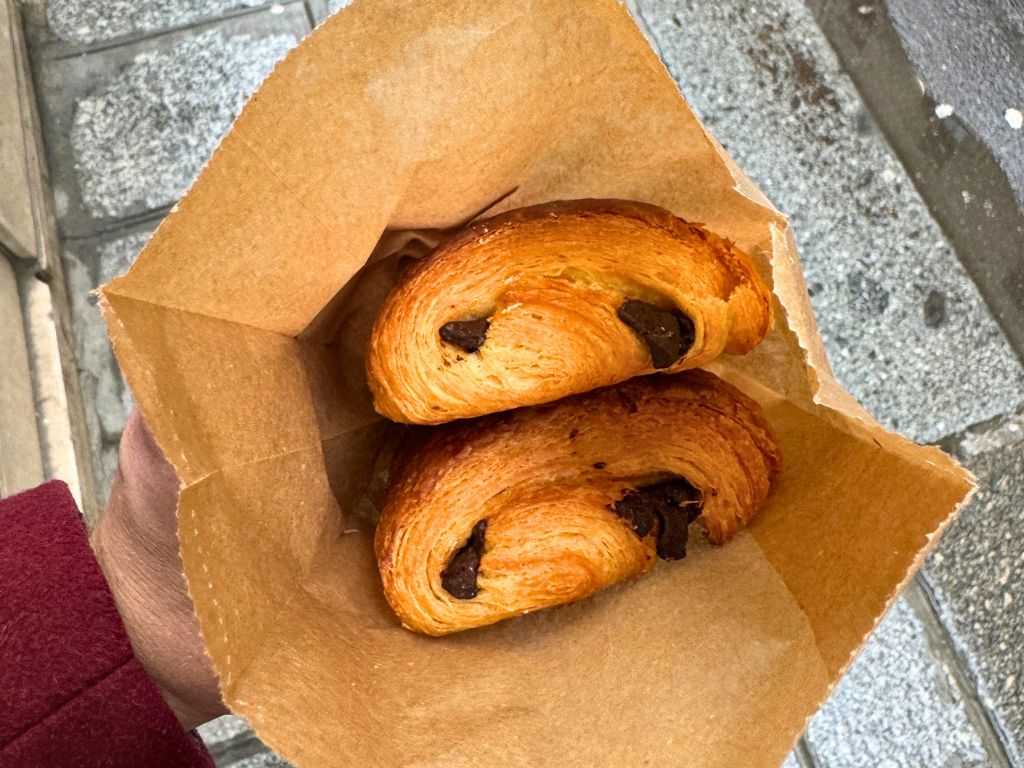 pain au chocolat in a takeaway bag in paris