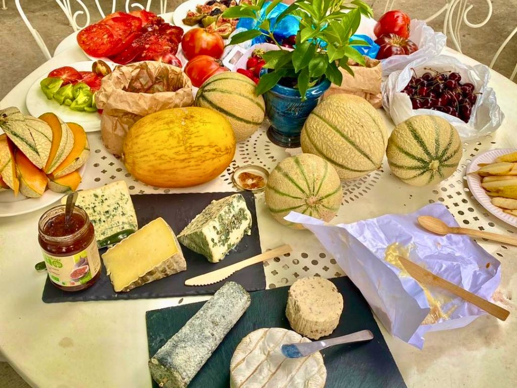 provence vs french riviera table of cheese and fresh produce