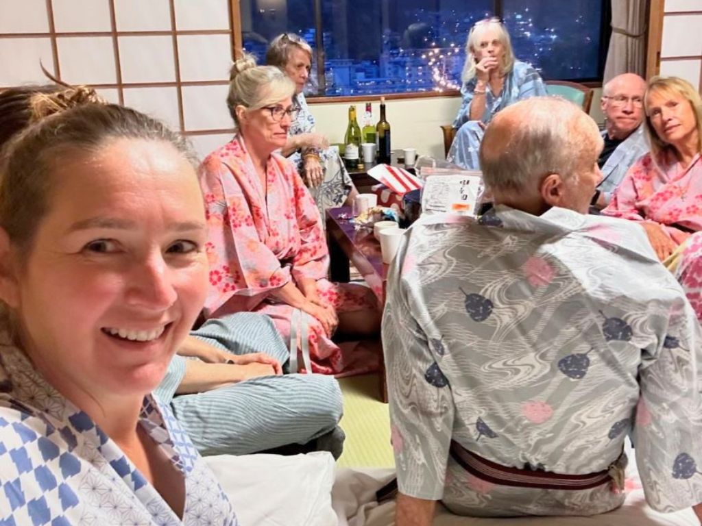 sarah and group selfie in an onsen in japan